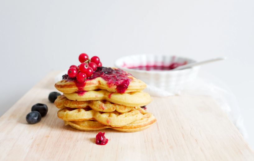 Heart shaped waffles with a berry sauce